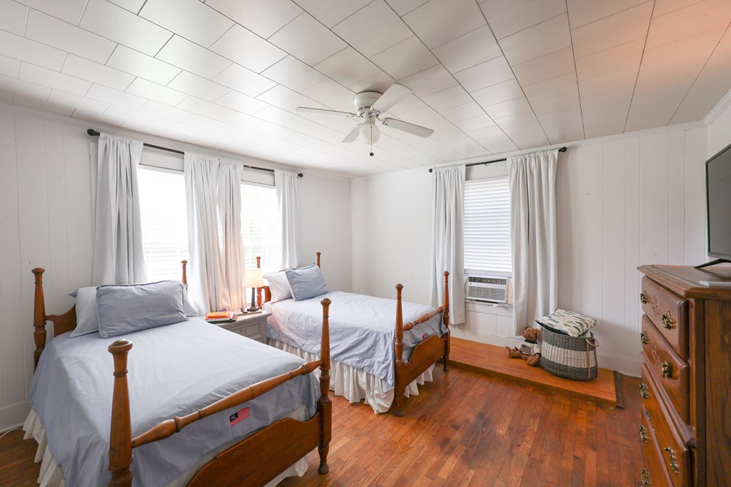 211 Williams Street Valley, AL 36854 - Photo 23 of 28 a bedroom with two beds and large windows