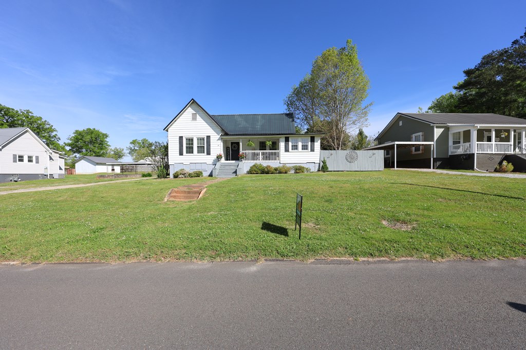 211 Williams Street Valley, AL 36854 - Photo 4 of 28 a front view of a house with a yard