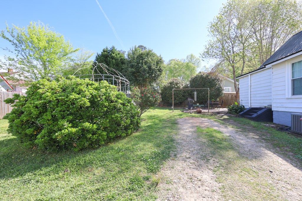 211 Williams Street Valley, AL 36854 - Photo 6 of 28 a backyard of a house with lots of green space