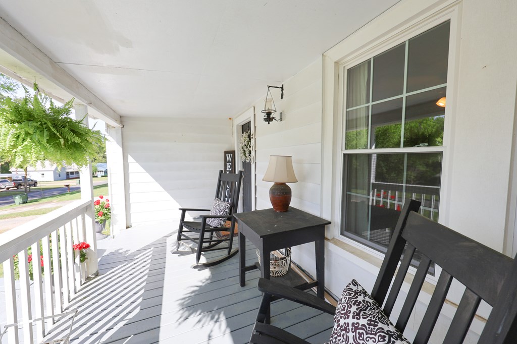 211 Williams Street Valley, AL 36854 - Photo 10 of 28 a dining room with furniture large windows and wooden floor