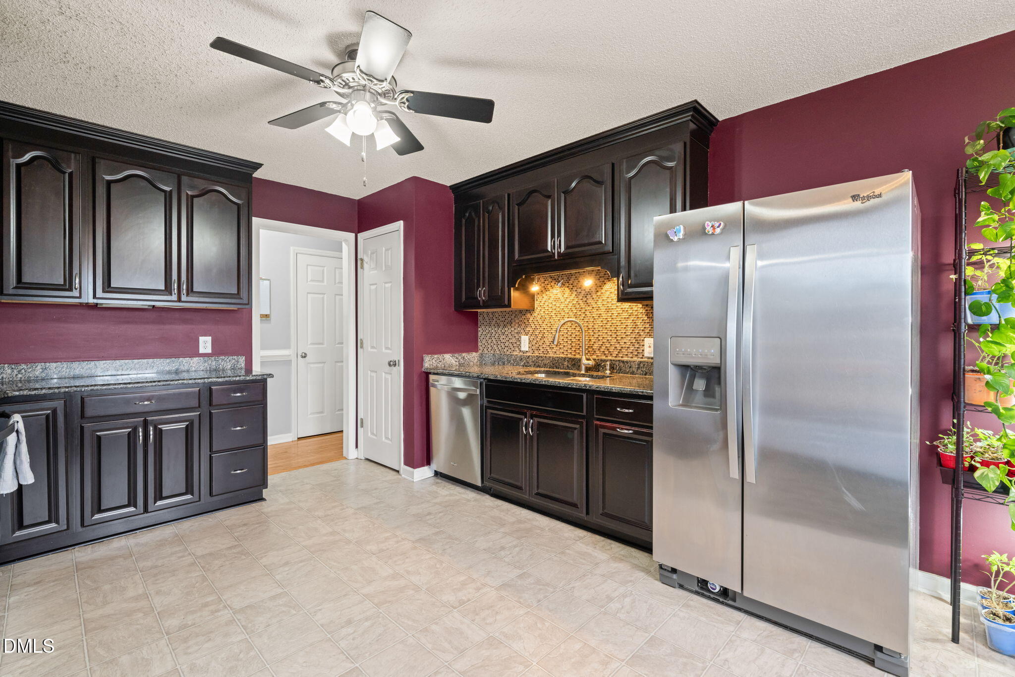 16 Saddle Ridge Drive Willow Spring, NC 27592 - Photo 16 of 57 a kitchen with stainless steel appliances granite countertop a refrigerator a stove and a sink