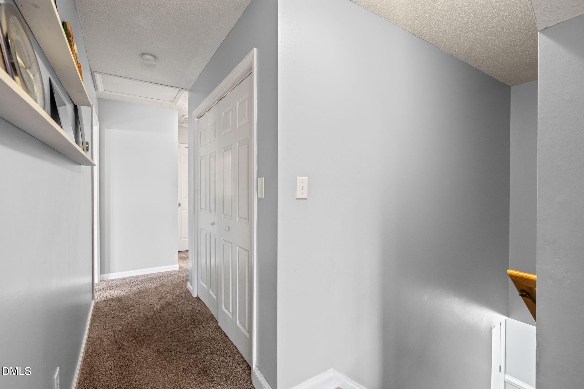 16 Saddle Ridge Drive Willow Spring, NC 27592 - Photo 22 of 57 a view of a hallway with wooden floor and staircase