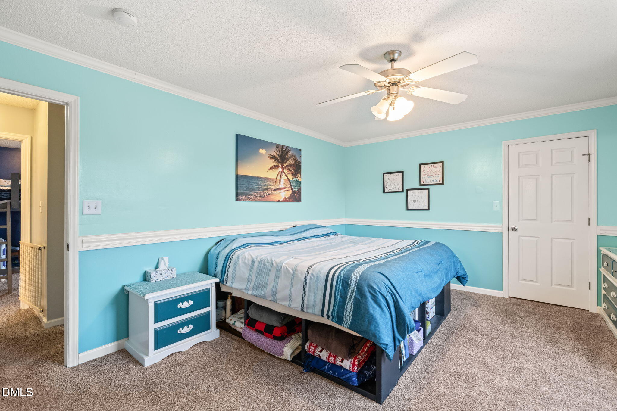 16 Saddle Ridge Drive Willow Spring, NC 27592 - Photo 24 of 57 a bedroom with a bed and a chandelier