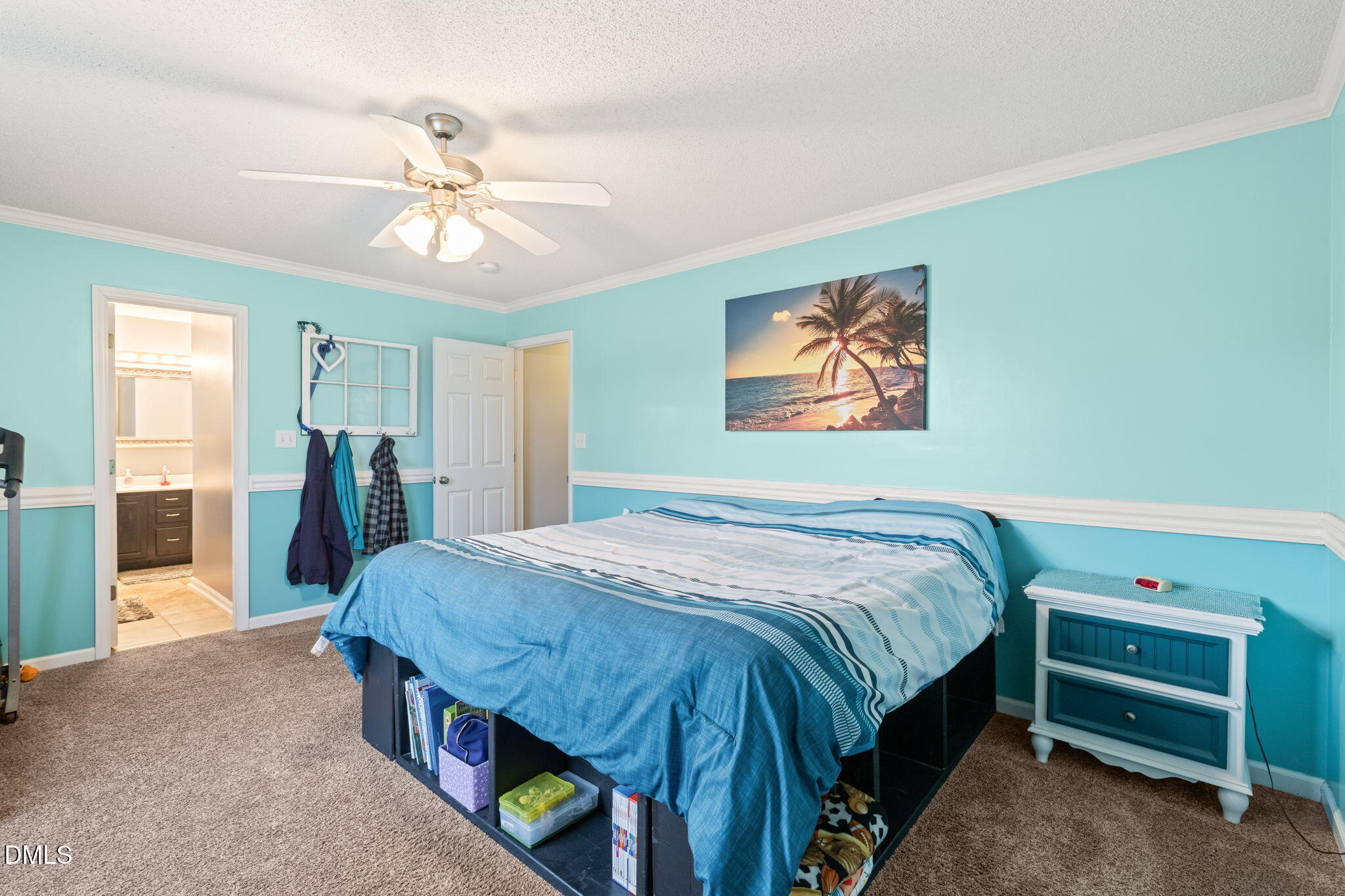 16 Saddle Ridge Drive Willow Spring, NC 27592 - Photo 25 of 57 a bedroom with a bed and a chandelier