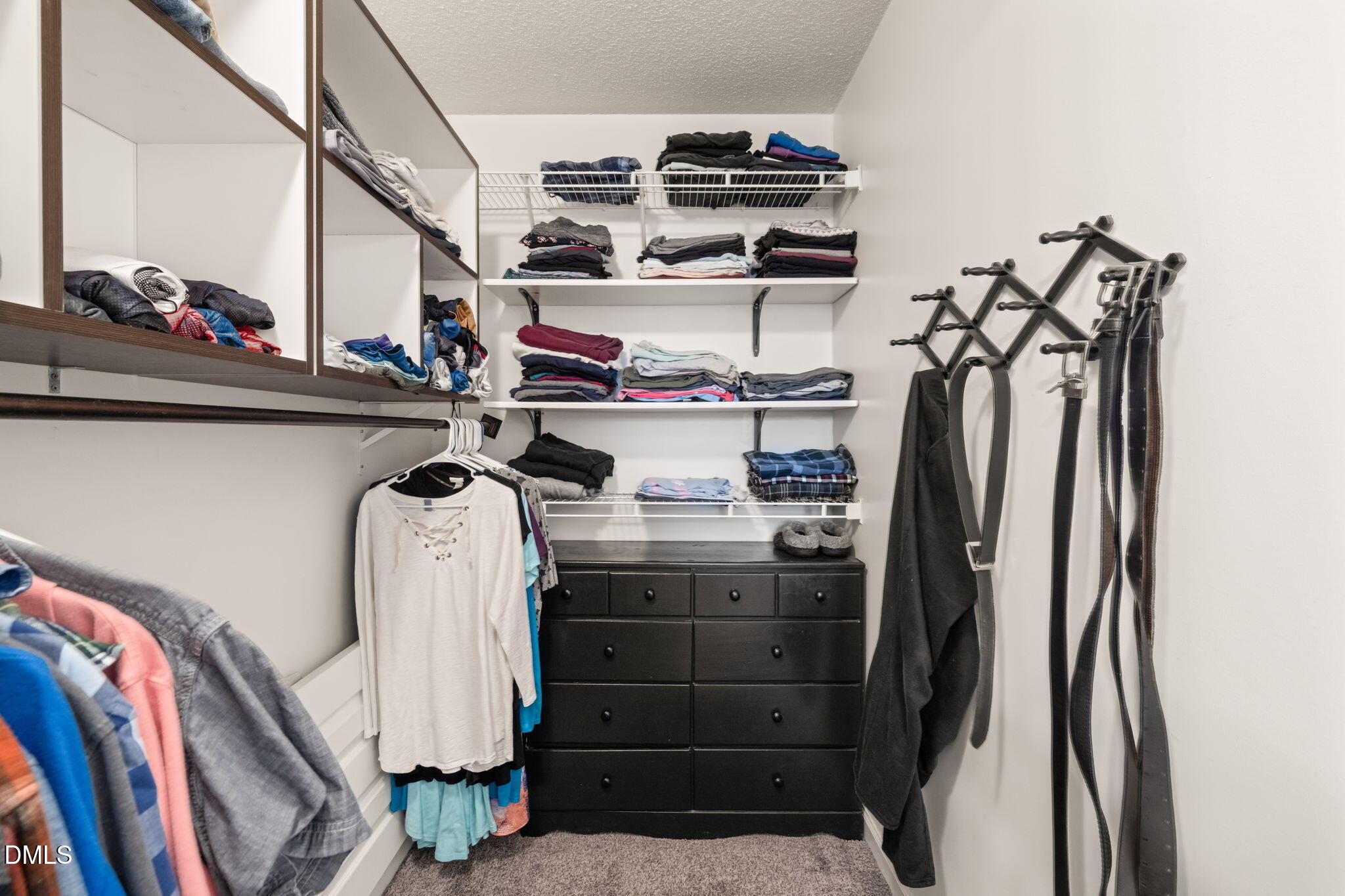 16 Saddle Ridge Drive Willow Spring, NC 27592 - Photo 28 of 57 a view of walk in closet with clothes and shoes
