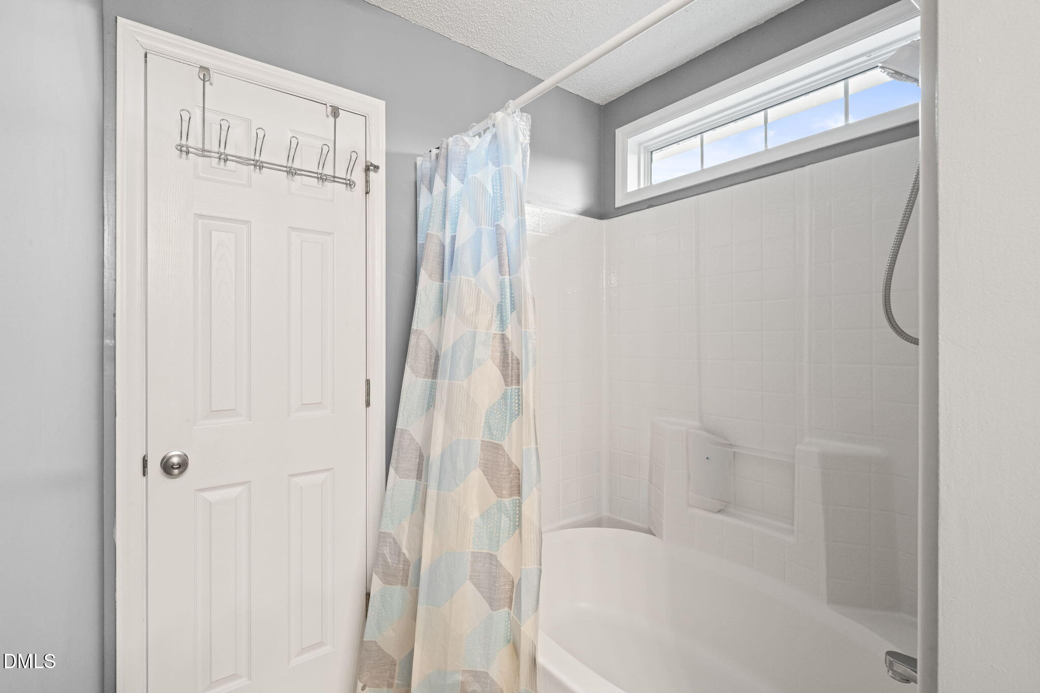 16 Saddle Ridge Drive Willow Spring, NC 27592 - Photo 29 of 57 a bathroom with a shower and a tub