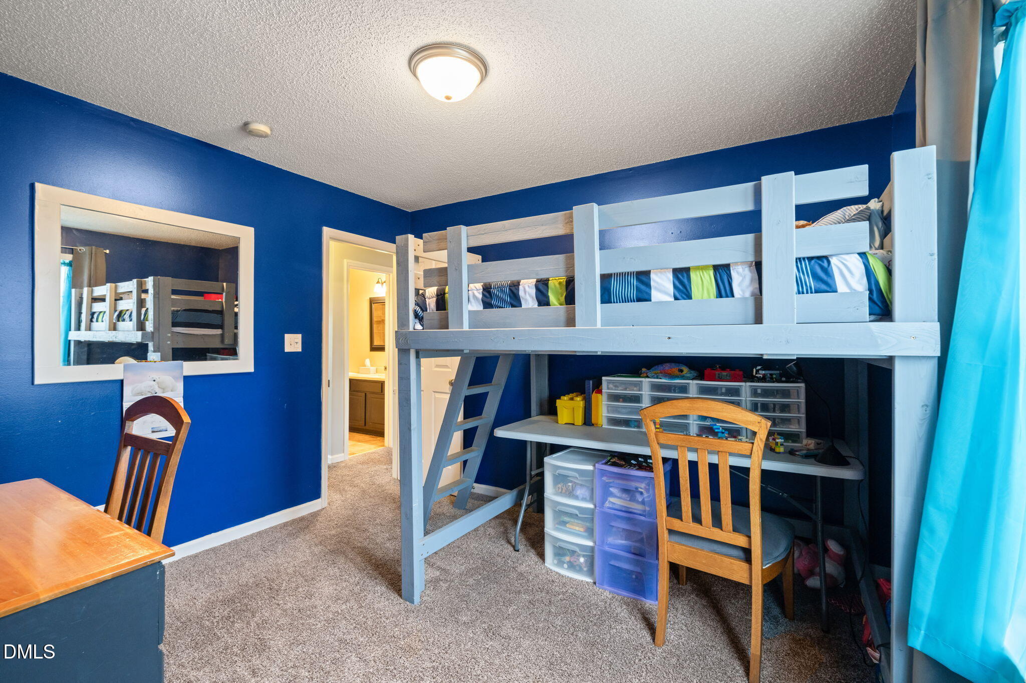 16 Saddle Ridge Drive Willow Spring, NC 27592 - Photo 30 of 57 a bed room with a bed and a book shelf