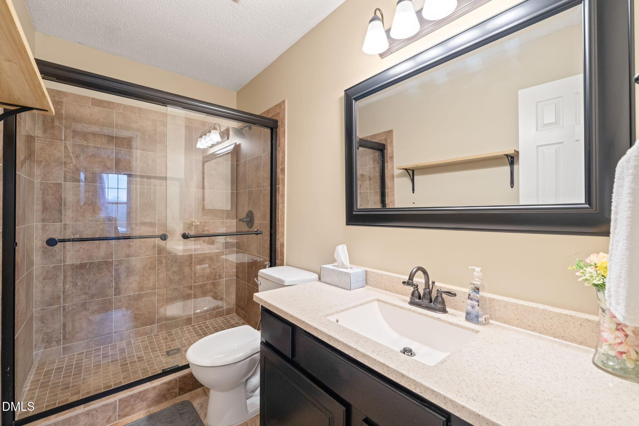 16 Saddle Ridge Drive Willow Spring, NC 27592 - Photo 35 of 57 a bathroom with a sink toilet and shower