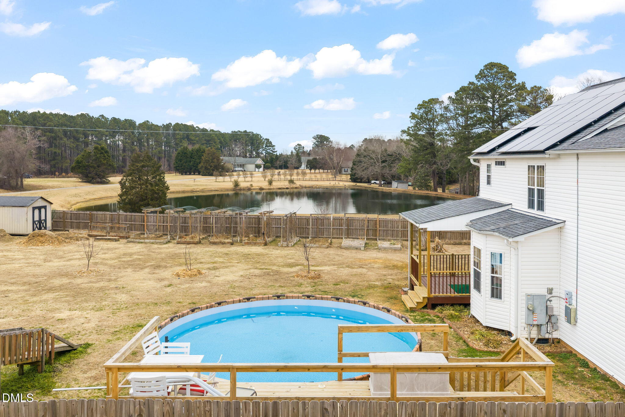 16 Saddle Ridge Drive Willow Spring, NC 27592 - Photo 44 of 57 a view of a swimming pool with an outdoor seating