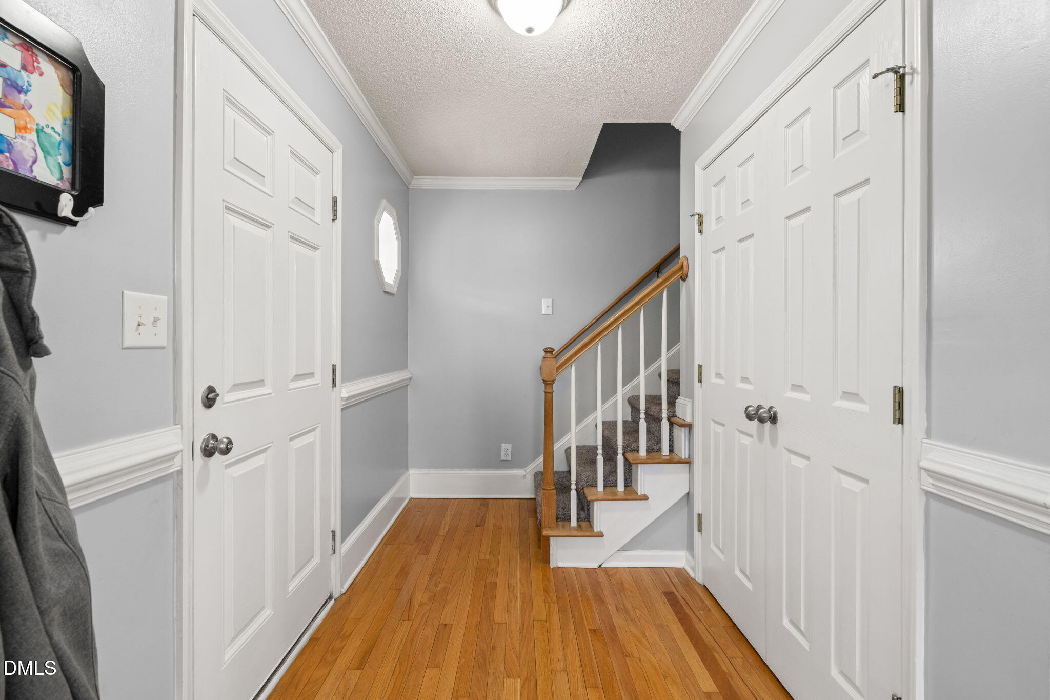 16 Saddle Ridge Drive Willow Spring, NC 27592 - Photo 6 of 57 a view of a hallway with wooden floor and staircase
