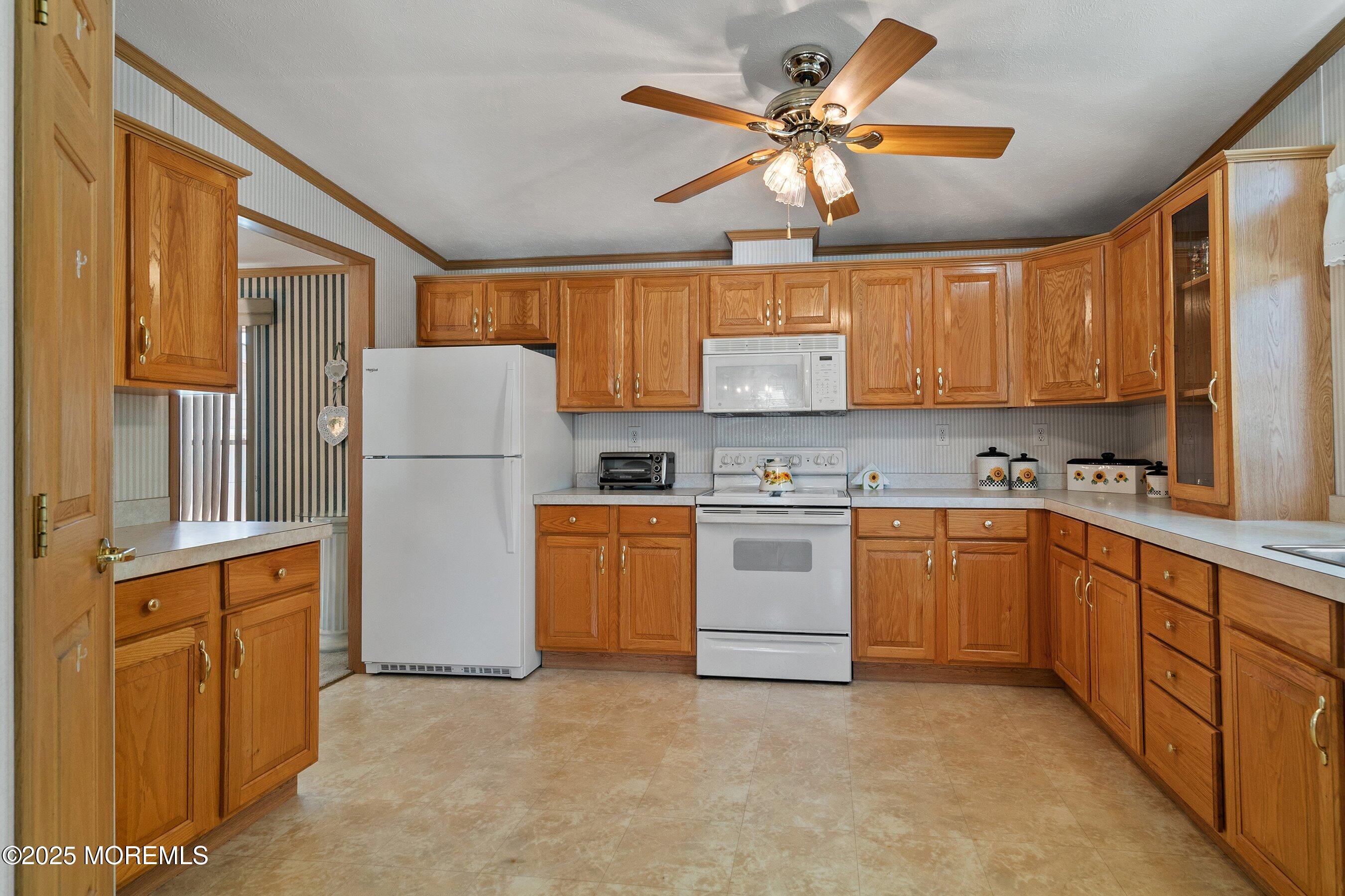 1104 Sycamore Court Whiting, NJ 08759 - Photo 15 of 55 a kitchen with refrigerator cabinets and a window
