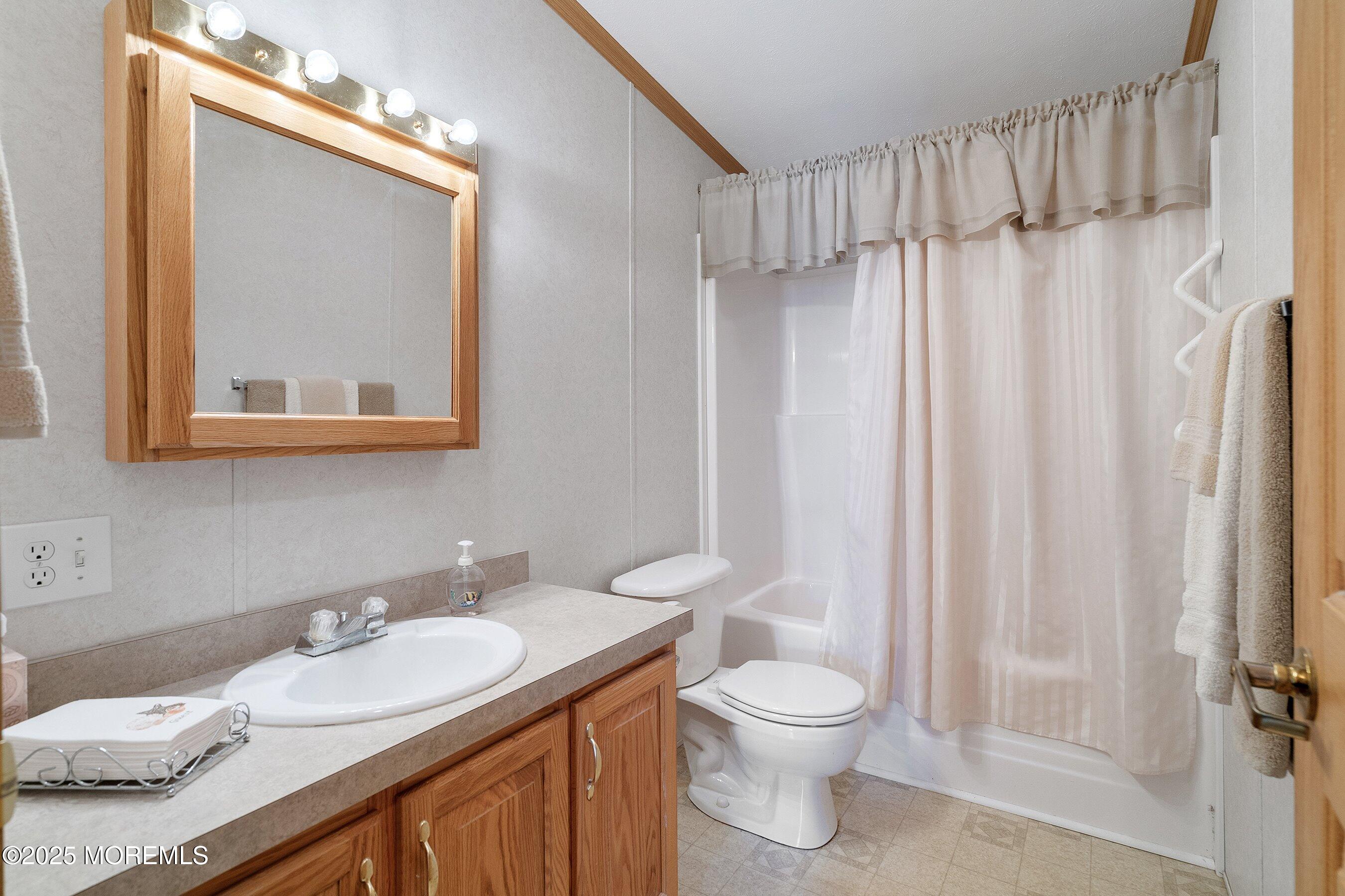 1104 Sycamore Court Whiting, NJ 08759 - Photo 25 of 55 a bathroom with a granite countertop sink toilet and shower