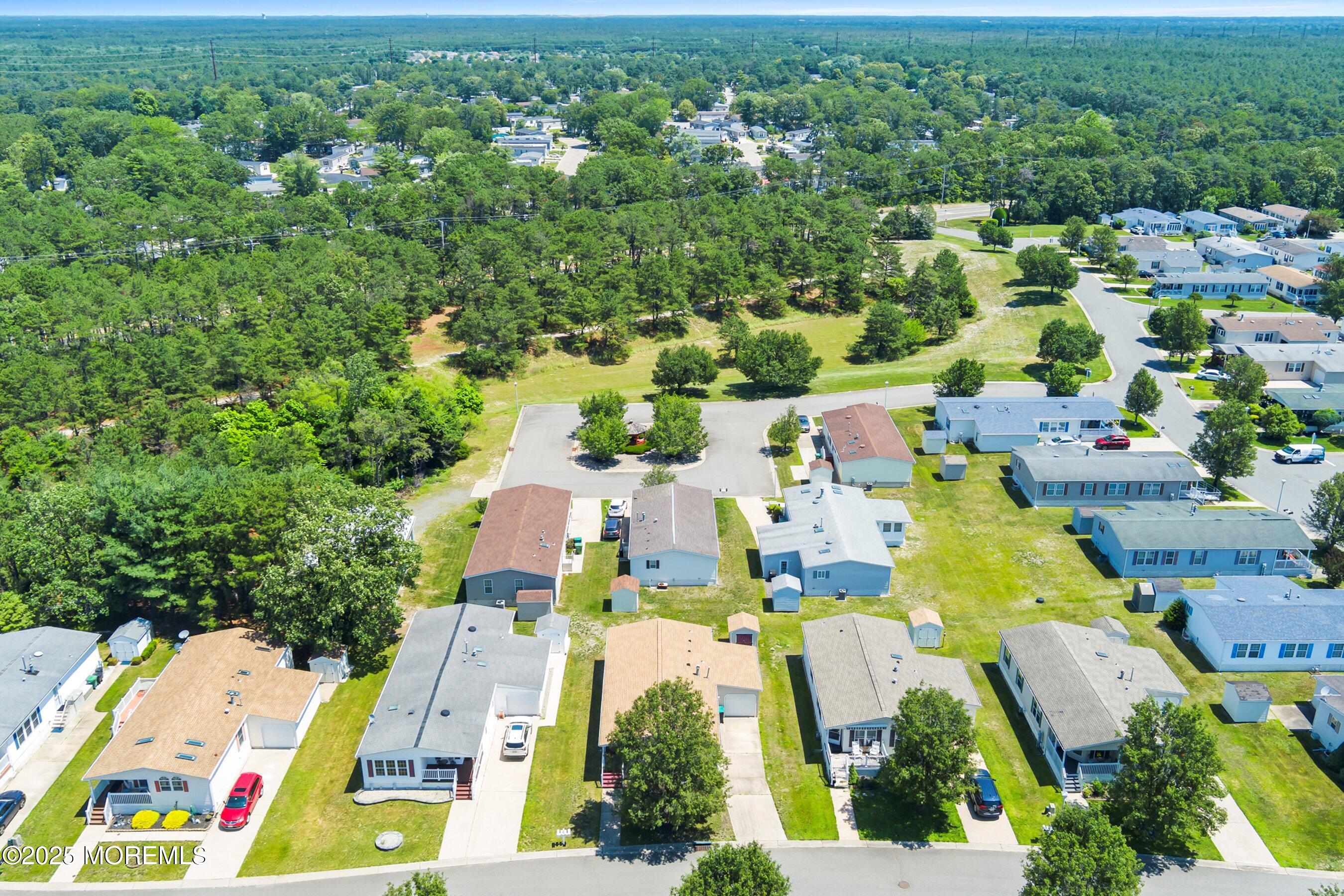 1104 Sycamore Court Whiting, NJ 08759 - Photo 4 of 55 an aerial view of residential houses with outdoor space
