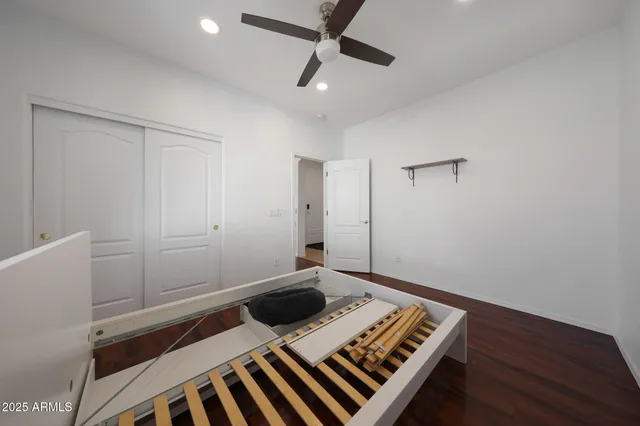 a view of an empty room and wooden floor