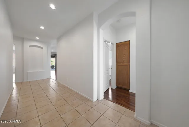 a view of an empty room and a bathroom