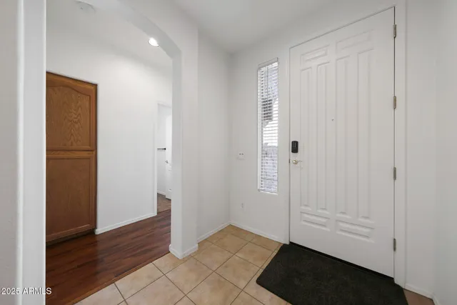 an empty room with wooden floor