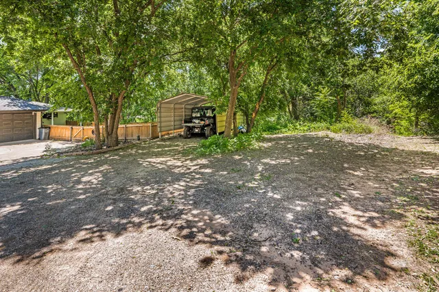 a view of a house with a tree