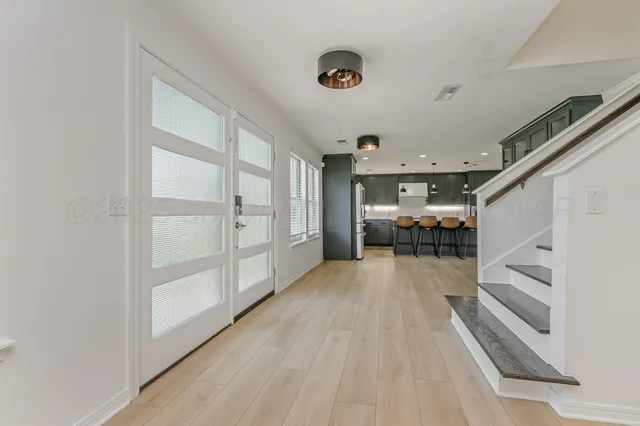 a view of livingroom with furniture and workspace