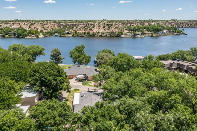 an aerial view of a city and lake view