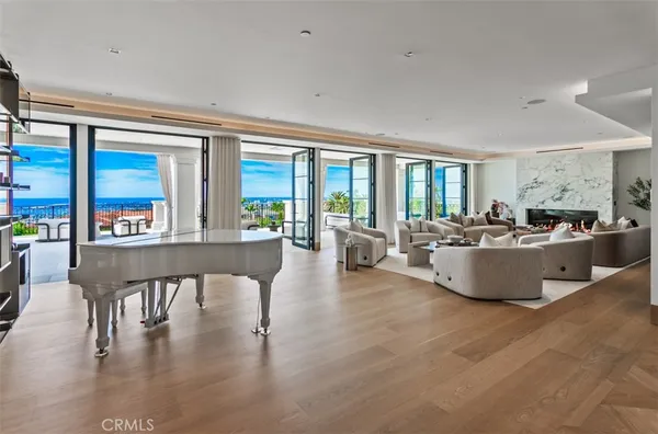 a living room with furniture and large windows