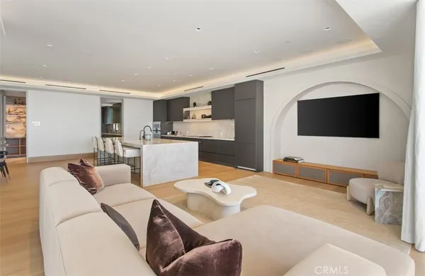 a bedroom with furniture and a large window