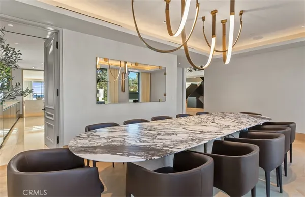 a bedroom with bed and a chandelier