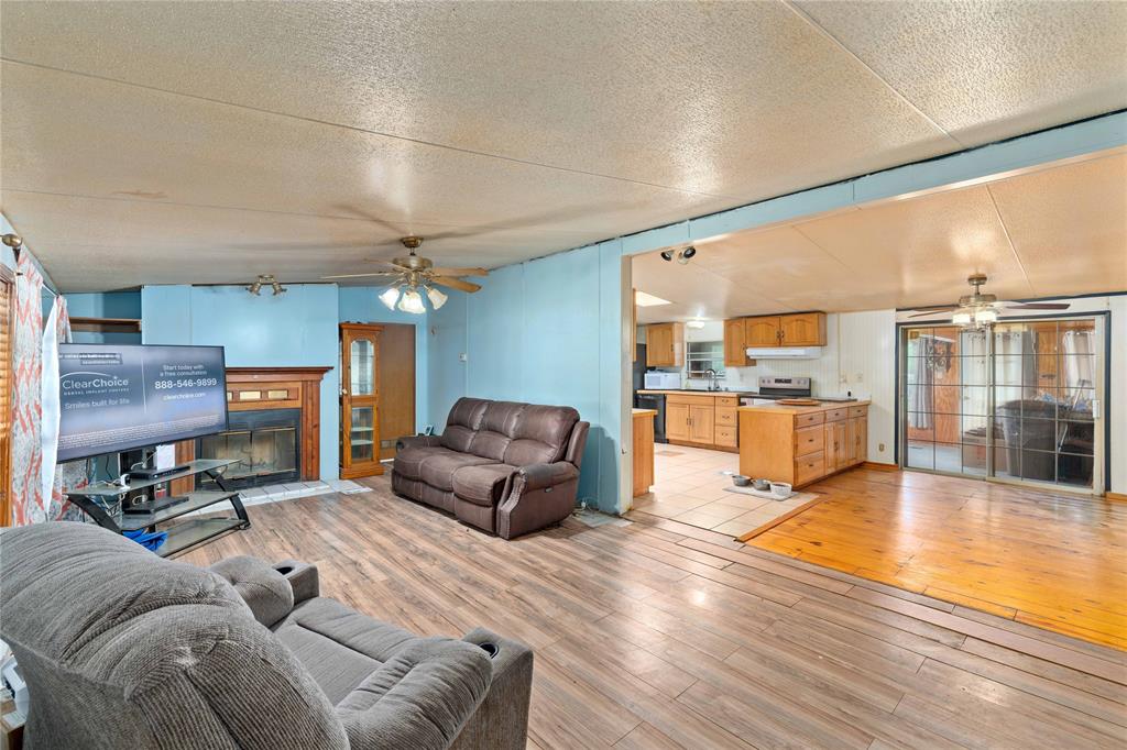 210 7th Street Blanket, TX 76432 - Photo 6 of 33 a living room with furniture and a flat screen tv