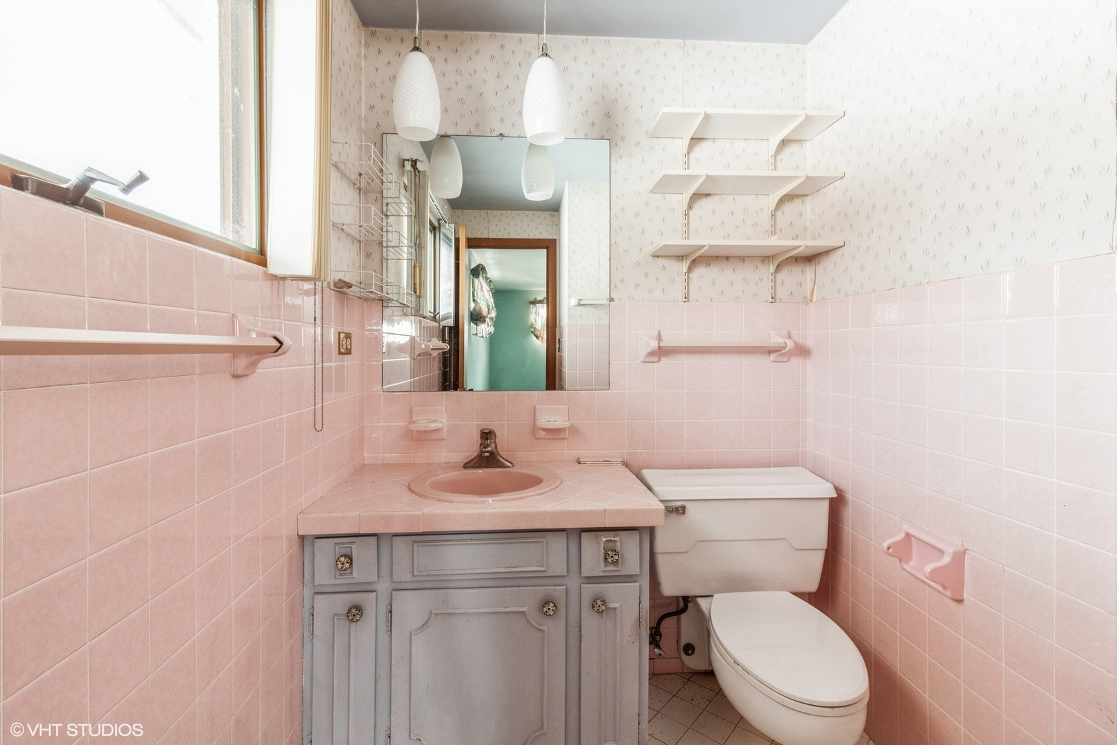 3412 York Road Oak Brook, IL 60523 - Photo 10 of 19 a bathroom with a granite countertop toilet sink and mirror