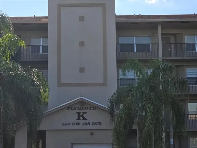 a bathroom with a shower and a glass door