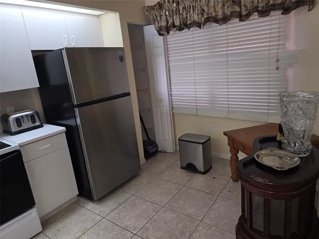 a kitchen with a sink stove and microwave