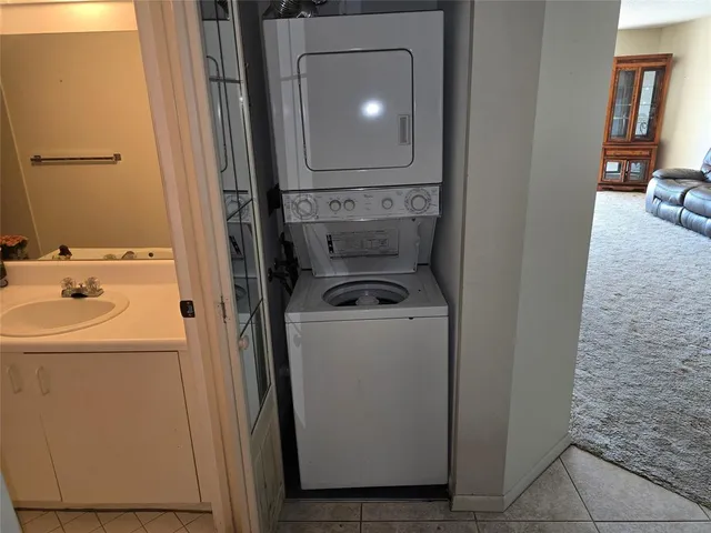 a bathroom with a sink a toilet and shower curtain