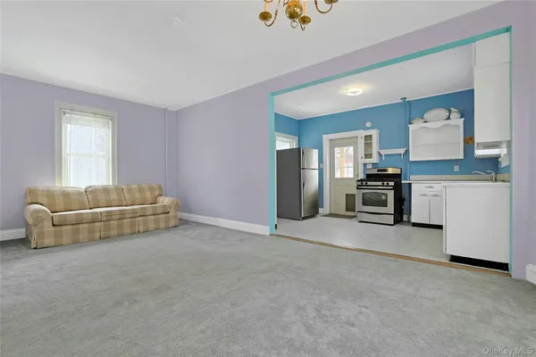 a kitchen with cabinets and stainless steel appliances