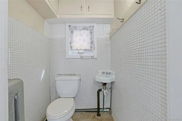 an empty room with wooden floor and closet