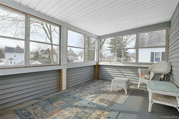 a view of lot of window with wooden floor