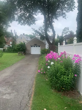 a house view with garden space