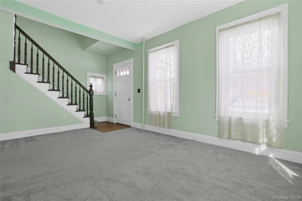 a view of a hallway with staircase