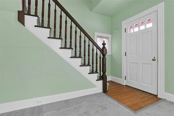 a view of a livingroom with a staircase