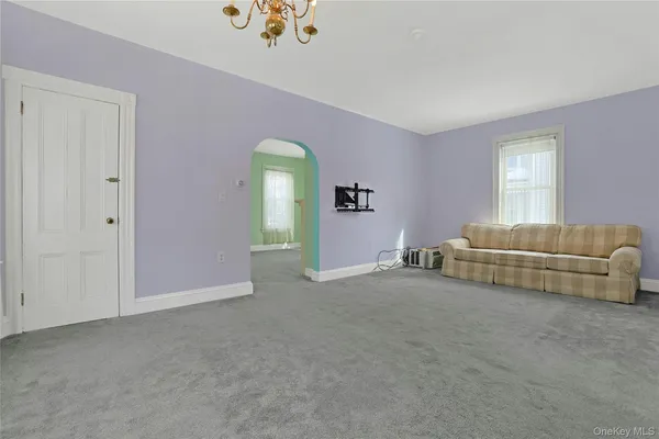 a large kitchen with a refrigerator a sink dishwasher a dining table and chairs