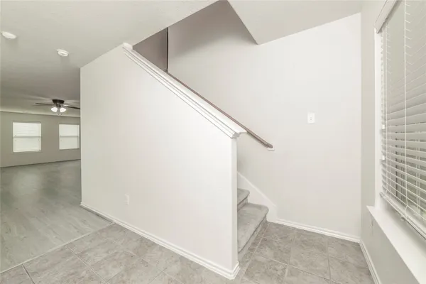 a view of a hallway with staircase