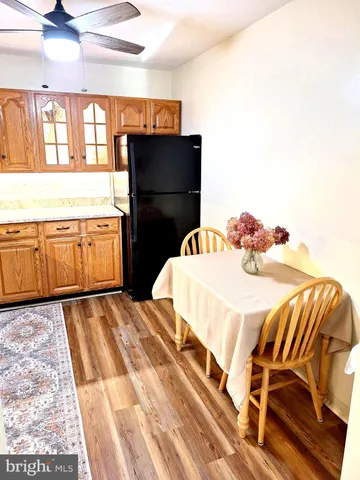 a bedroom with a bed and wooden cabinets
