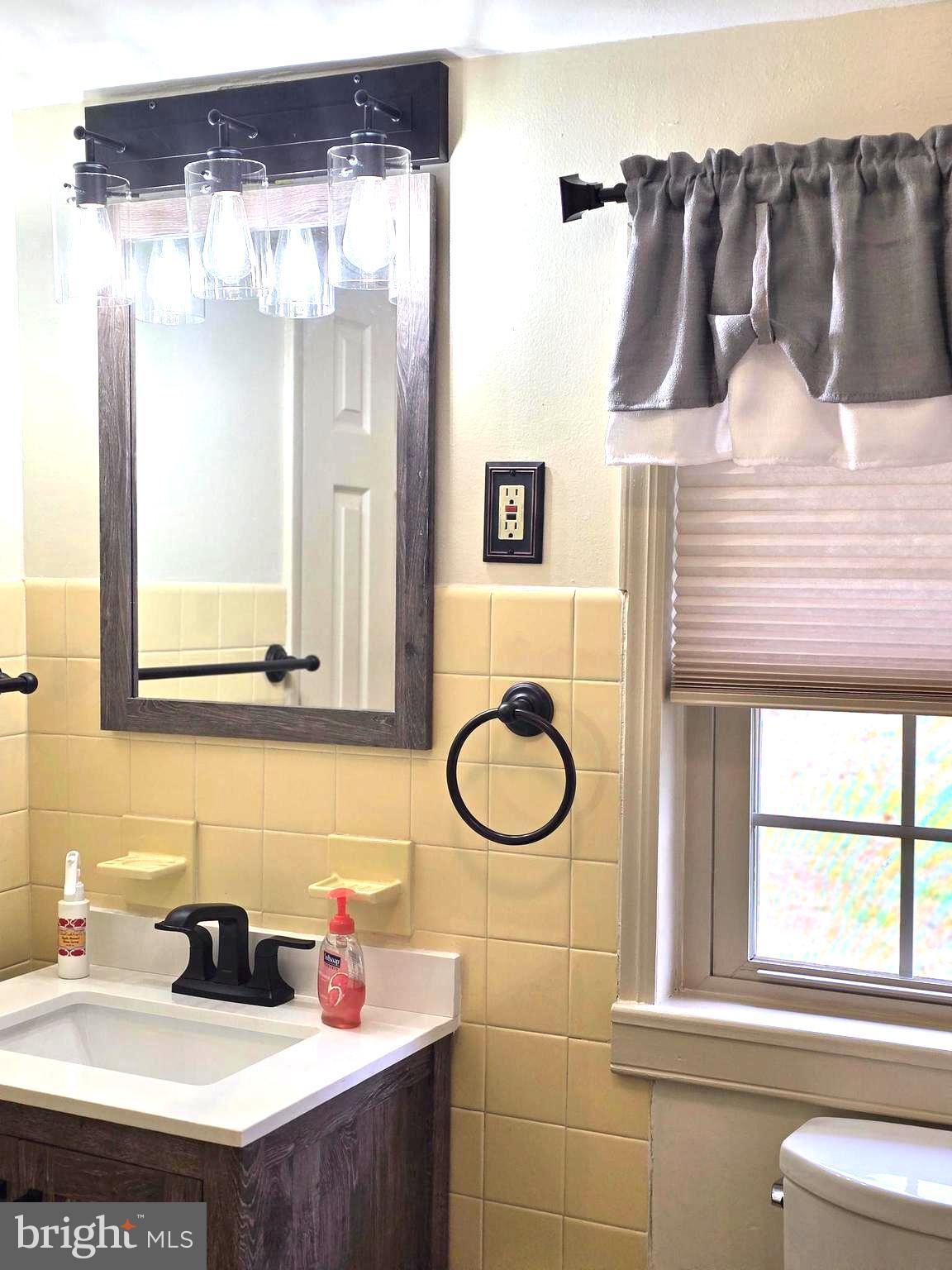 1951 Conestoga Road, Unit 2 Chester Springs, PA 19425 - Photo 17 of 22 a bathroom with a sink and a mirror