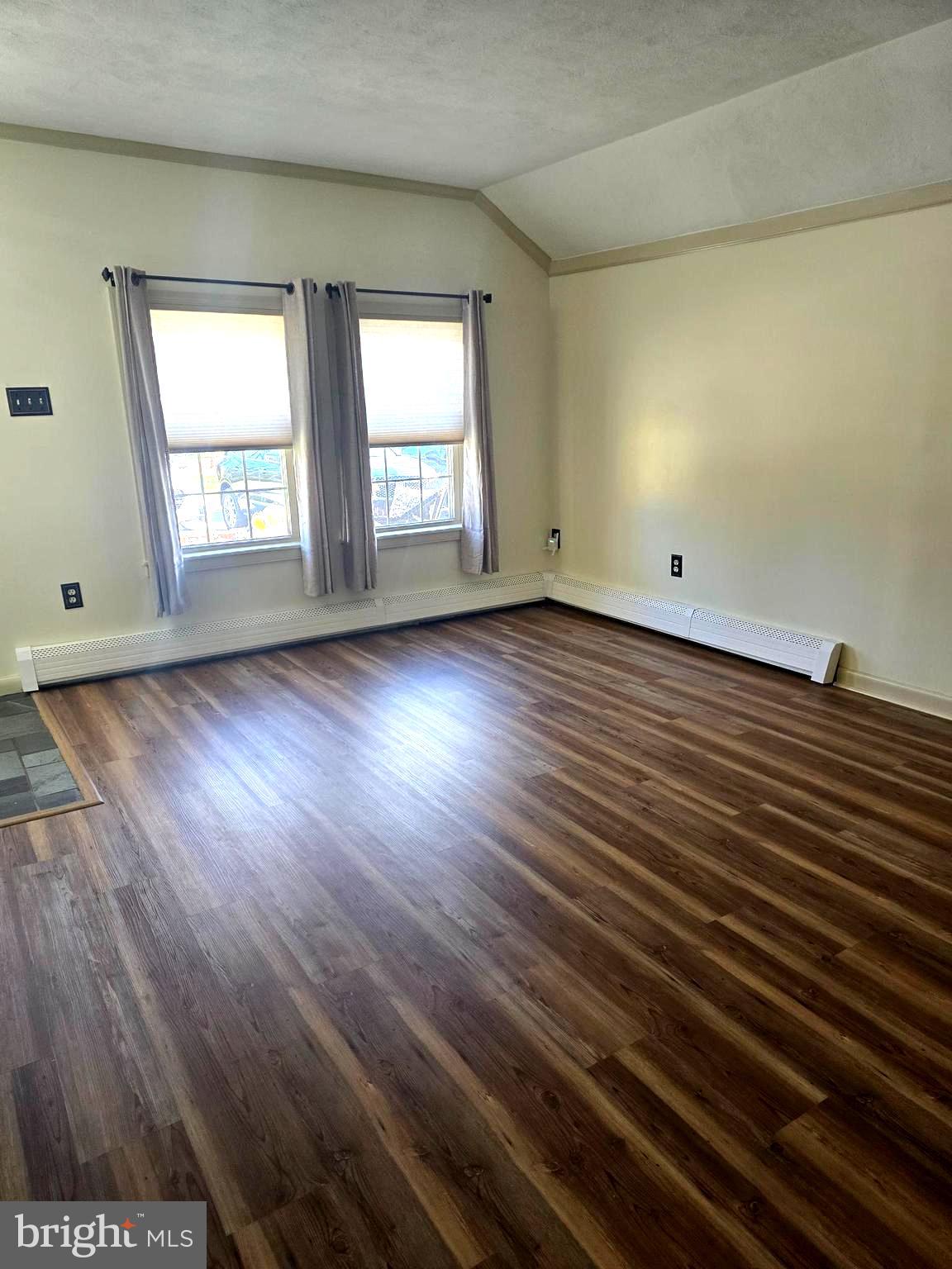 1951 Conestoga Road, Unit 2 Chester Springs, PA 19425 - Photo 6 of 22 an empty room with wooden floor and windows