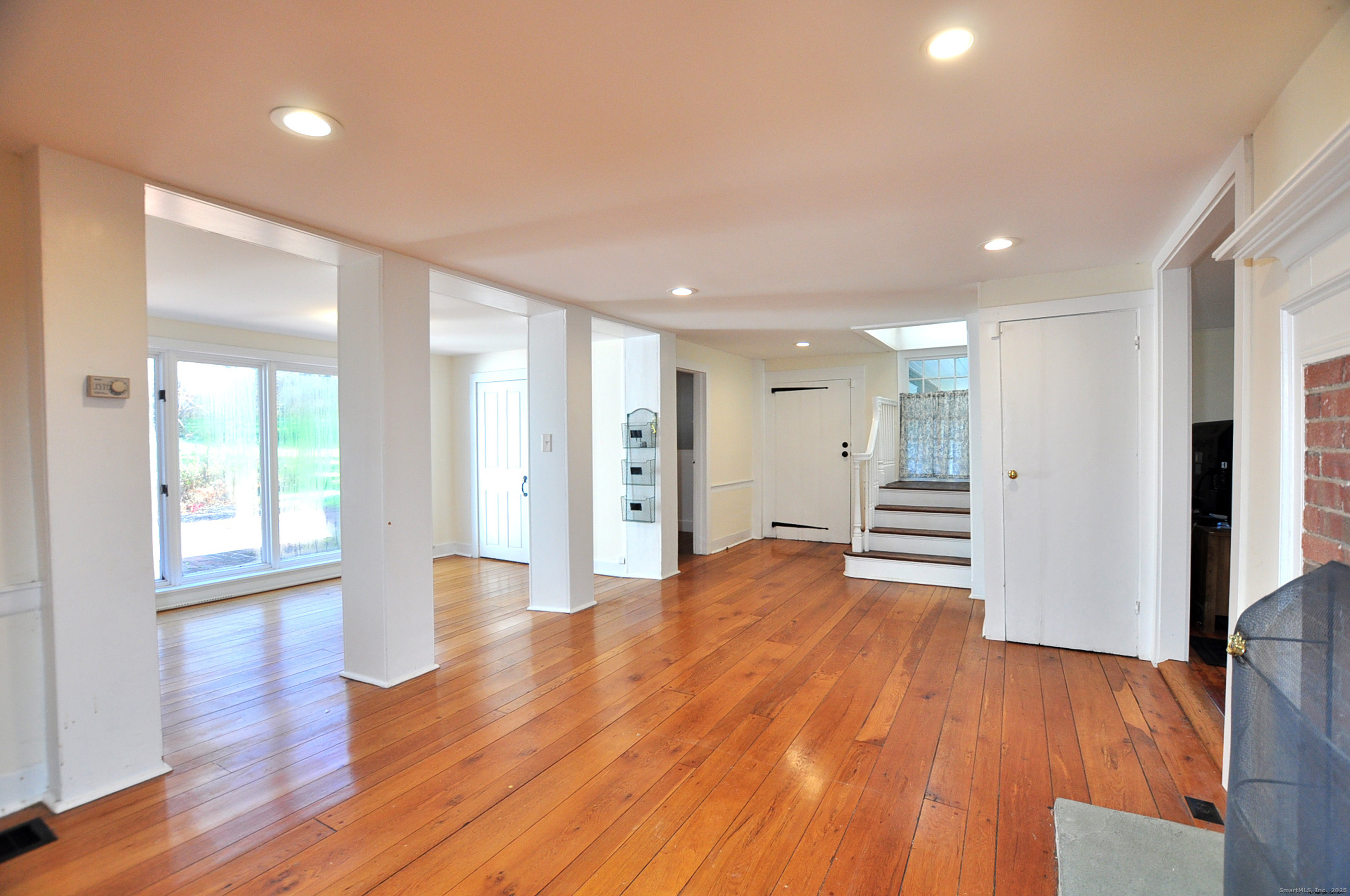 11 West Chestnut Hill Road Litchfield, CT 06759 - Photo 12 of 39 a view of an empty room with wooden floor and a window