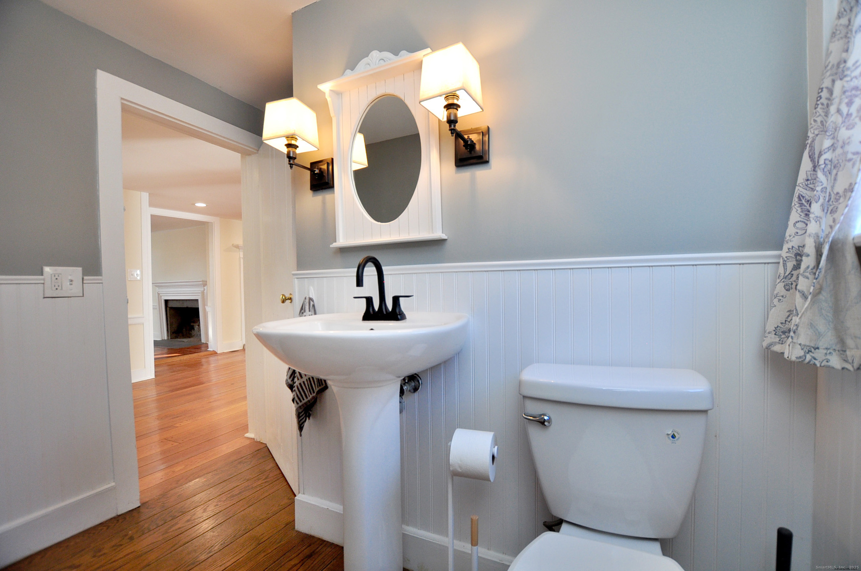 11 West Chestnut Hill Road Litchfield, CT 06759 - Photo 18 of 39 a bathroom with a toilet sink and mirror