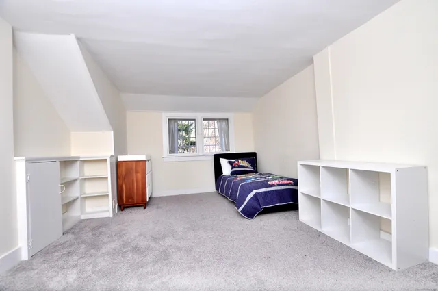 a room with furniture and a window