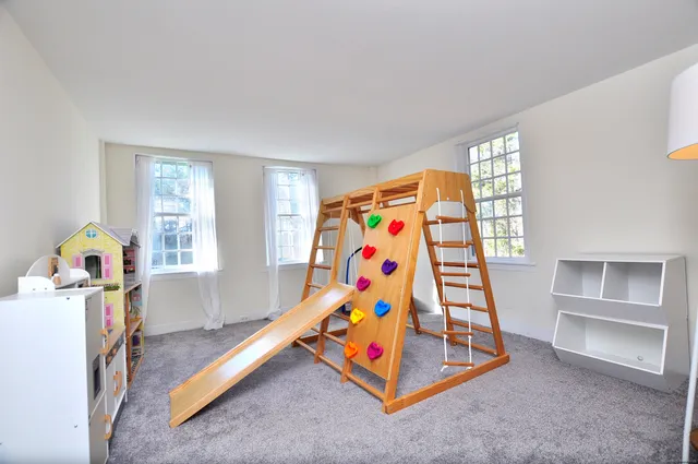 a bedroom with furniture and window