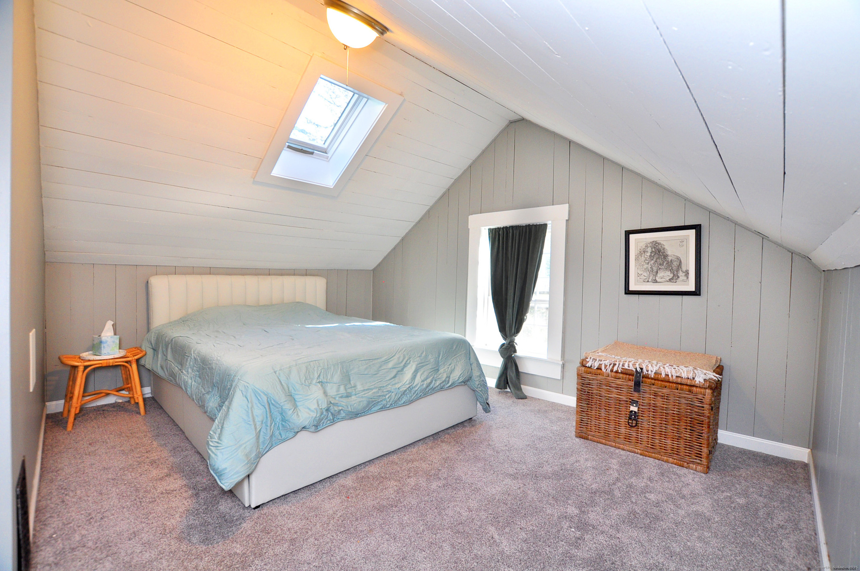 11 West Chestnut Hill Road Litchfield, CT 06759 - Photo 32 of 39 a spacious bedroom with a bed and a lamp on wall