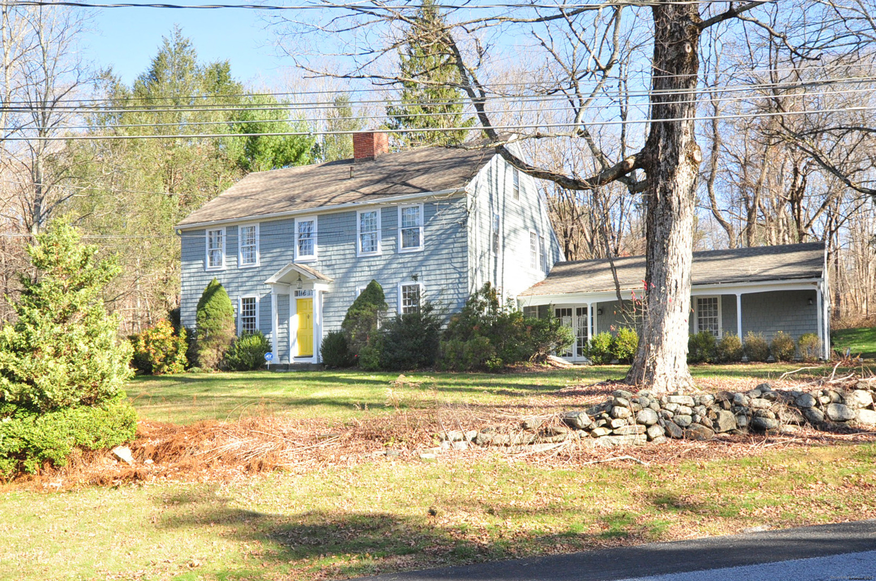 11 West Chestnut Hill Road Litchfield, CT 06759 - Photo 4 of 39 a view of a house with a yard and plants