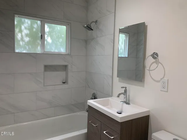a bathroom with a sink and toilet