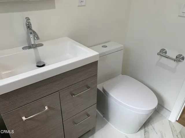 a bathroom with a shower and mirror
